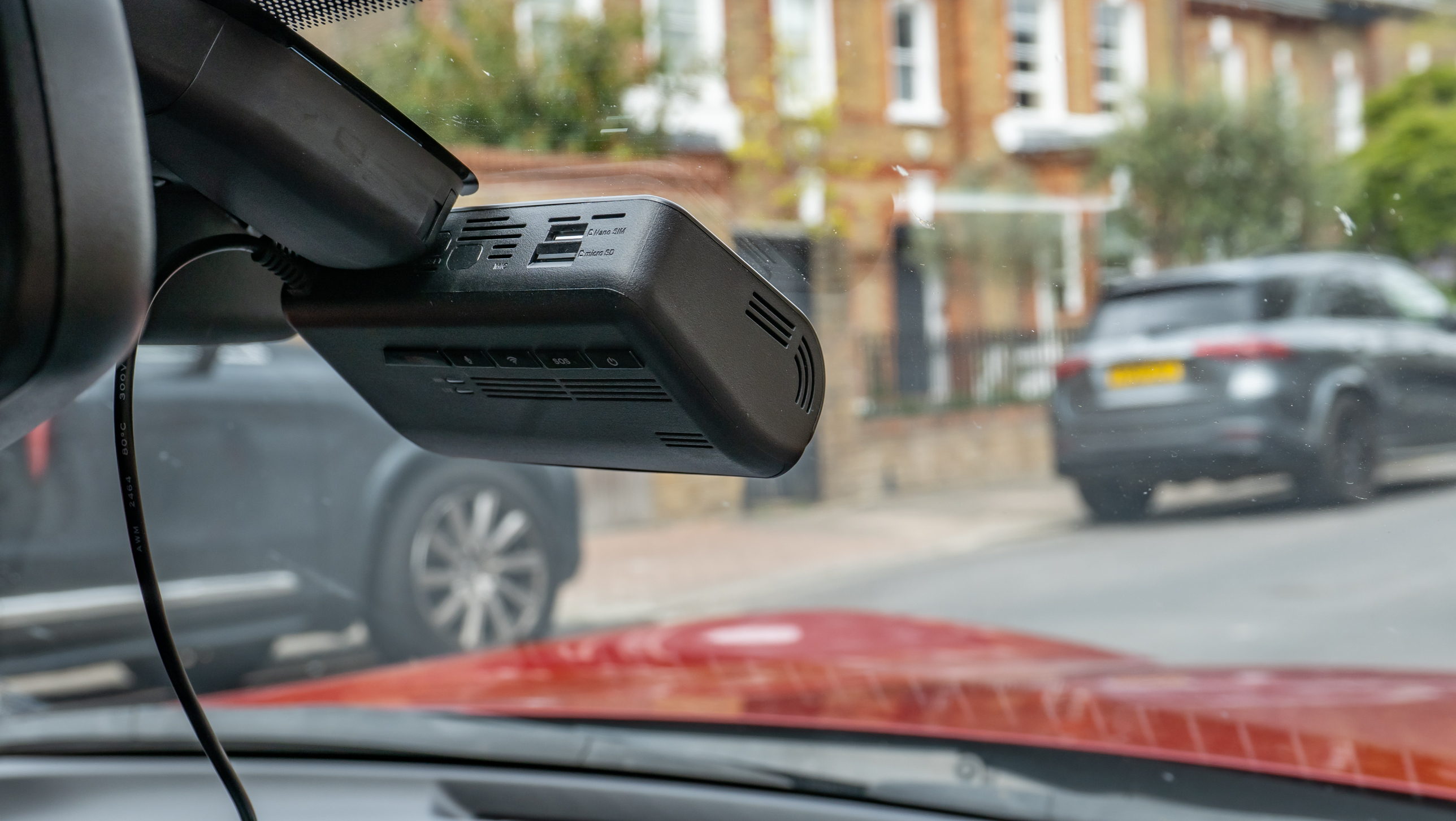 The Thinkware T700 dash cam mounted inside a car's windscreen