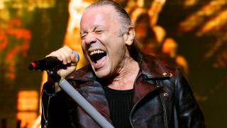 Bruce Dickinson singing onstage with Iron Maiden in 2025