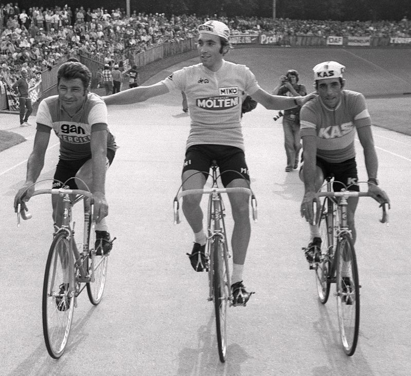 Eddy Merckx does a victory lap at the end of the 1971 Tour de France with Raymond Poulidor on his left and Vicente L&oacute;pez Carril on his right