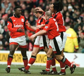 Stuart Pearce, centre left, celebrates with his Forest team-mates after scoring against Middlesbrough