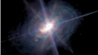 A three colour image of the galaxy ESO 428-G14 as captured by the James Webb Space Telescope