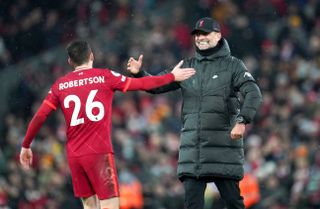 Liverpool manager Jurgen Klopp (right) and Liverpool’s Andrew Robertson after the Premier League match at Anfield, Liverpool. Picture date: Saturday December 11, 2021