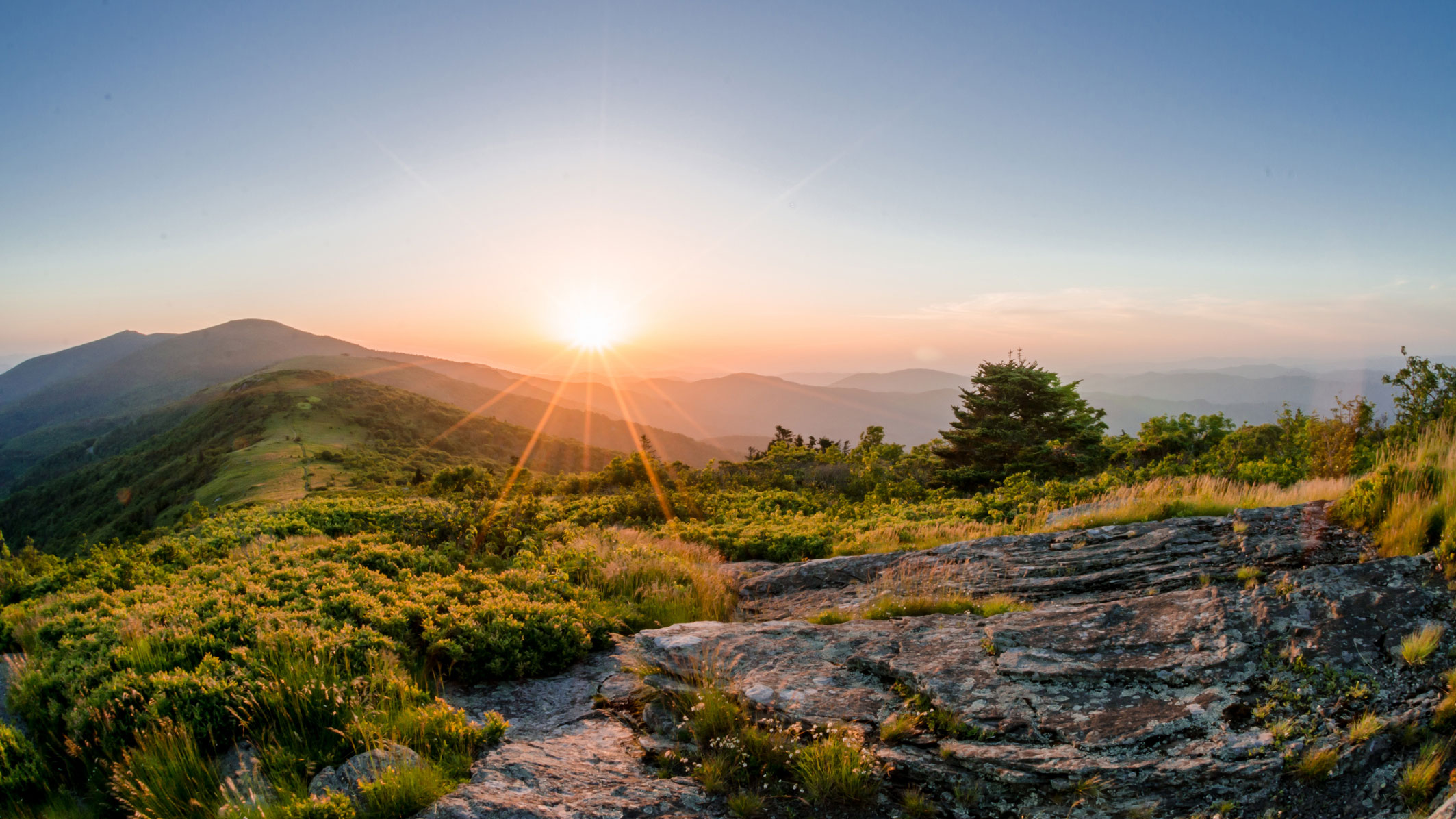 Sun rising over a mountain top