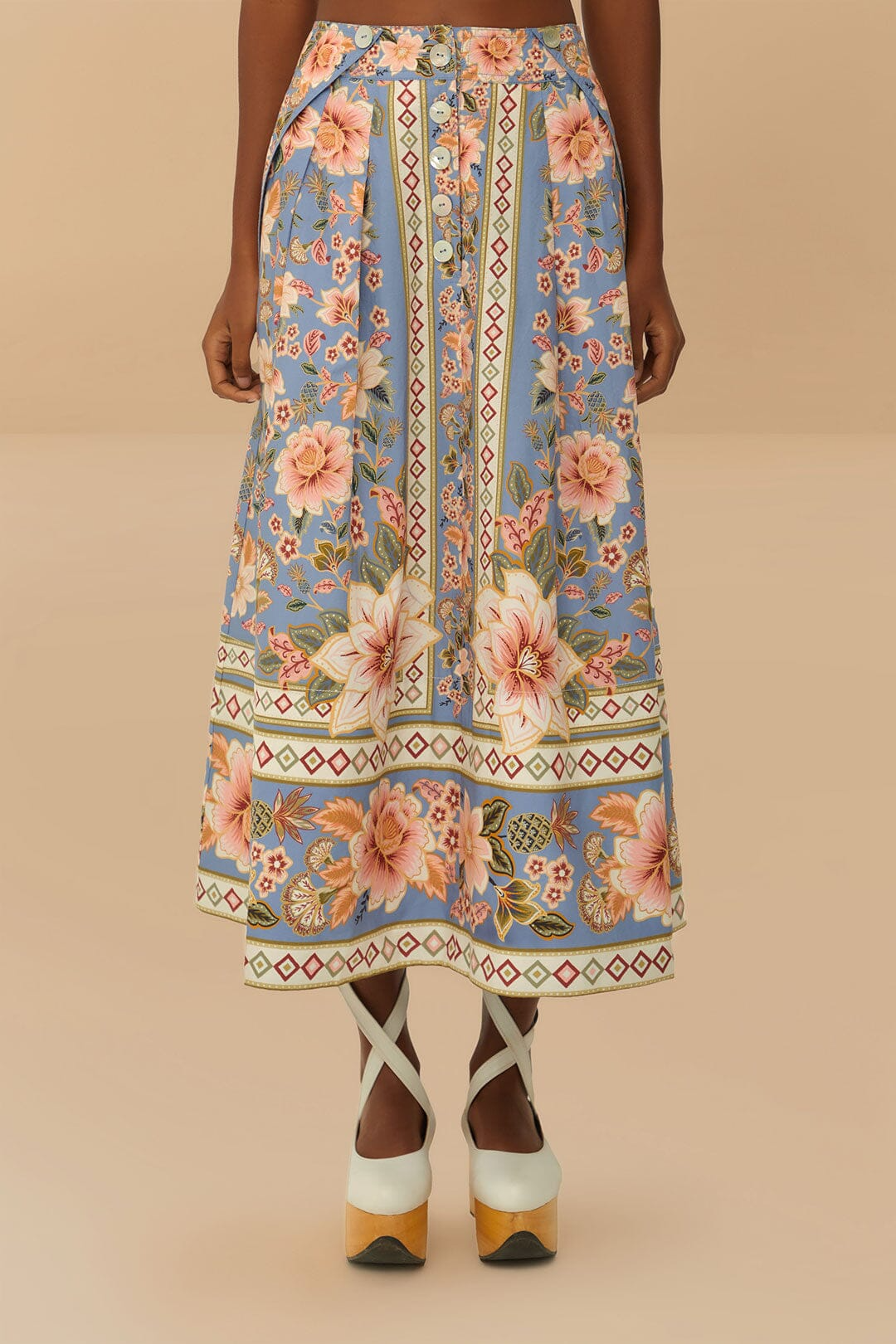 A model wearing a blue floral maxi skirt