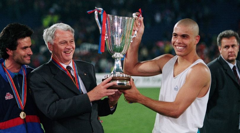 Bobby Robson and Ronaldo celebrate Barcelona&#039;s UEFA Cup Winners&#039; Cup win with the trophy after victory against Paris Saint-Germain in the final in May 1997.