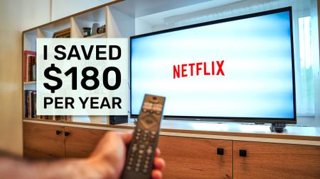Netflix on a TV set with hand holding remote