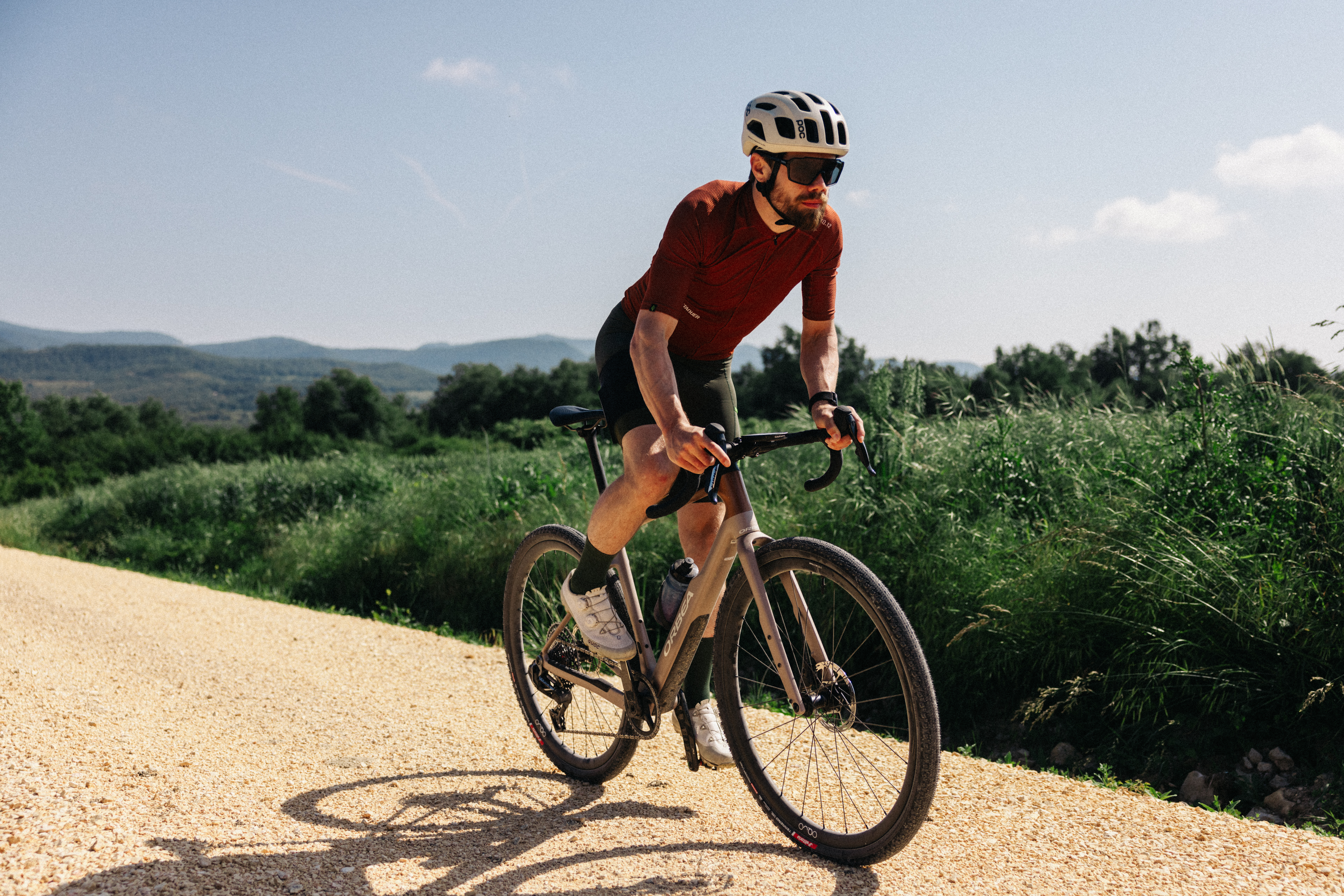 A man riding the new Orbea Terra on a Spanish gravel track