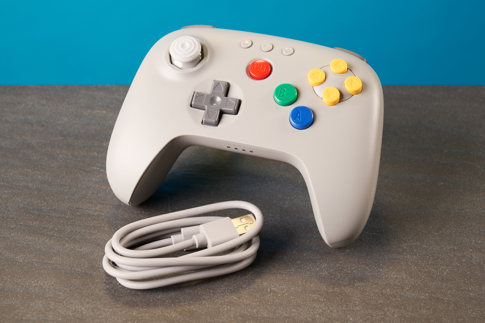 The 8BitDo 64 Controller against a blue background