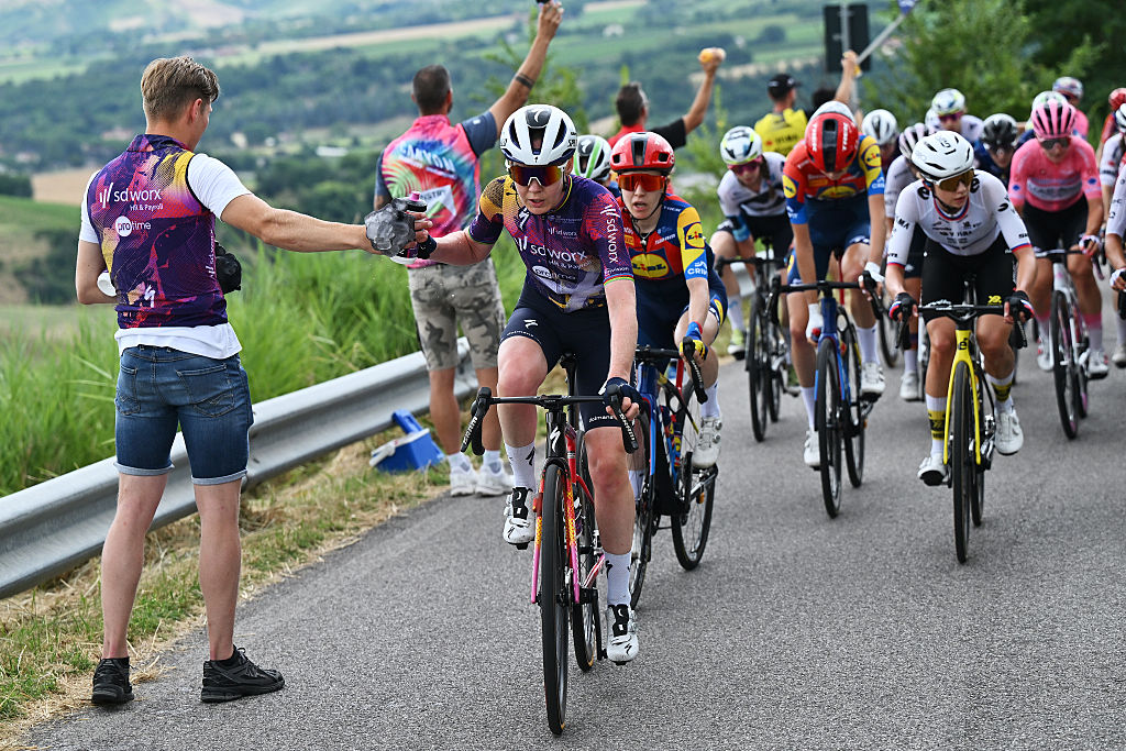IMOLA, ITALY - JULY 13: Anna Van Der Breggen of Netherlands and Team SD Worx - Protime picks bottles in the feed zone during the 36th Giro d'Italia Women 2025, Stage 8 a 134km stage from Forli to Imola / #UCIWWT / on July 13, 2025 in Imola, Italy. (Photo by Luc Claessen/Getty Images)
