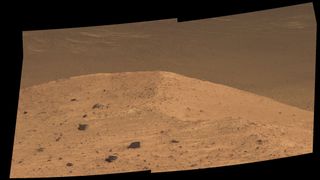 This Sept. 21, 2016, scene from NASA's Mars rover Opportunity shows "Spirit Mound" overlooking the floor of Endeavour Crater. The mound stands near the eastern end of Bitterroot Valley on the western rim of the crater; this view faces eastward.
