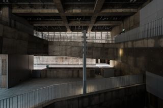 Sony Park Ginza and its brutalist volume, with meshed exterior and concrete interior