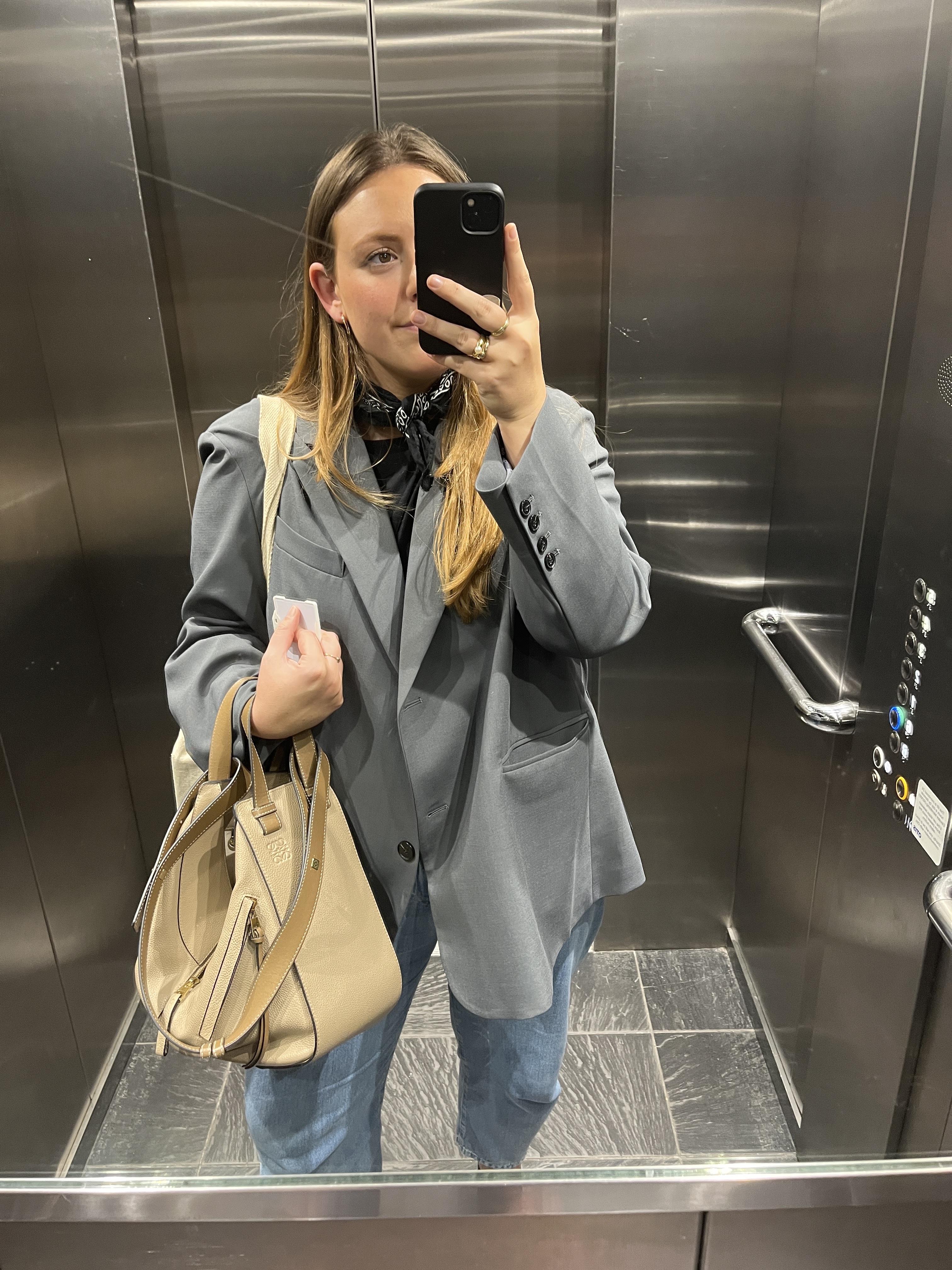 An image ofBest Knockoff Luxury Clothing
 UK Managing Editor, Poppy Nash, reviewing the Loewe hammock bag.