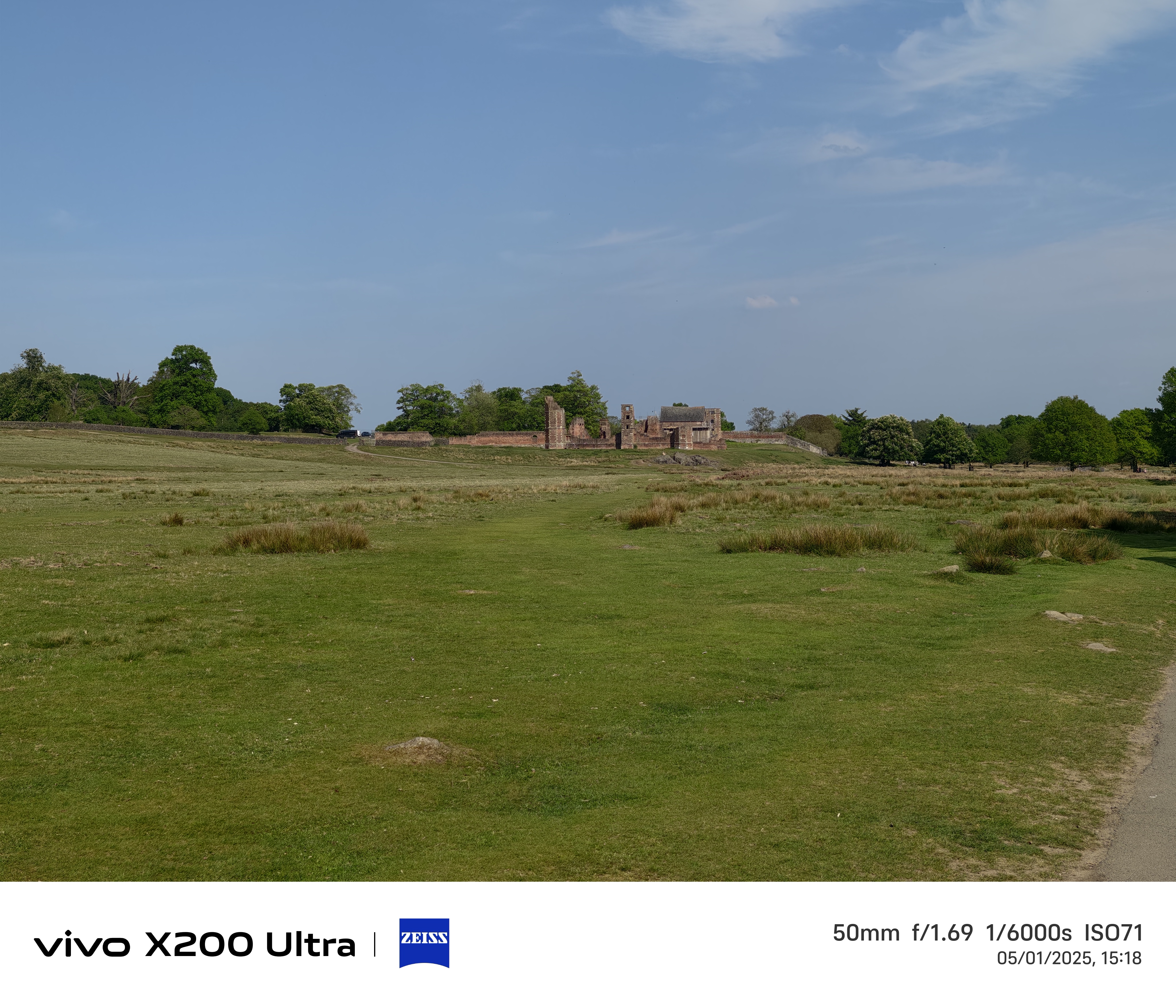 Old ruins in the distance across a field