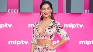 Cast member of 'Beecham House', Australian actress Pallavi Sharda poses on the pink carpet during the 2nd Canneseries - International Series Festival : Day Three on April 07, 2019 in Cannes, France.