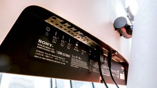Sony Inzone M9 gaming monitor shown from rear, with close up view of ports