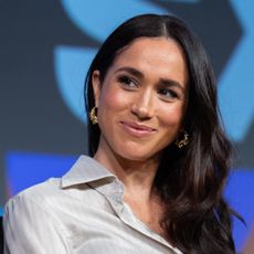 Meghan Markle smiles onstage at SXSW for an international womens day panel