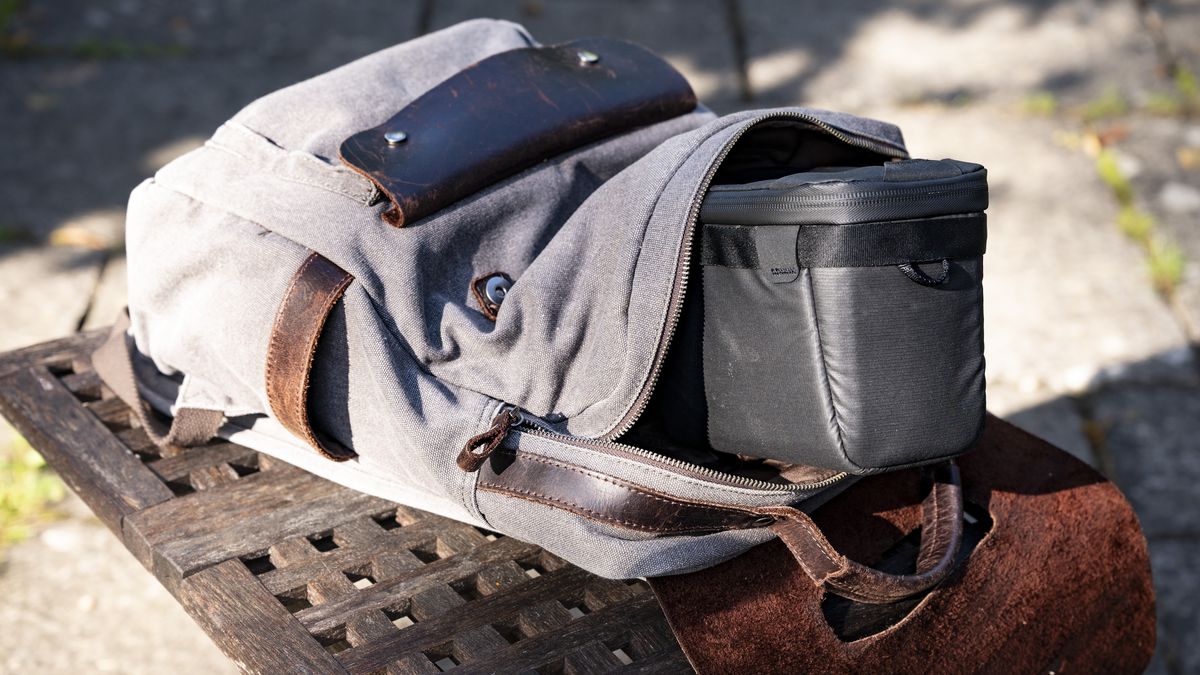 Peak Design Camera Cubes outside of a regular bag on wooden table outside