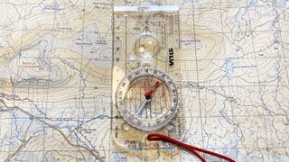 how to orientate a map: lining a compass up with map gridlines