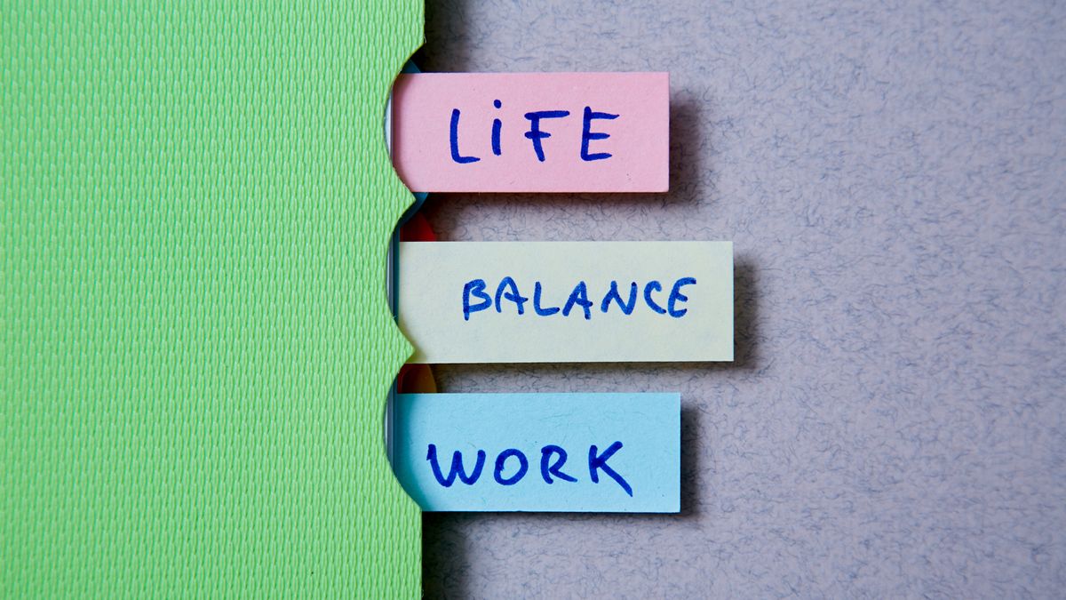 A folder with tabs reading &amp;#039;life&amp;#039;, &amp;#039;balance&amp;#039;, &amp;#039;work&amp;#039;