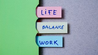 A folder with tabs reading 'life', 'balance', 'work'