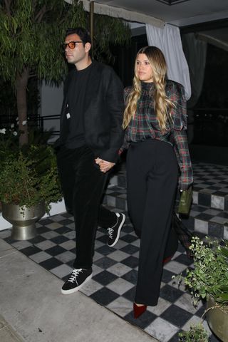 Sofia Richie wears burgundy heels.