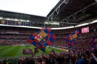 Barcelona fans wave flags during the 2011 Champions League final against Manchester United at Wembley.