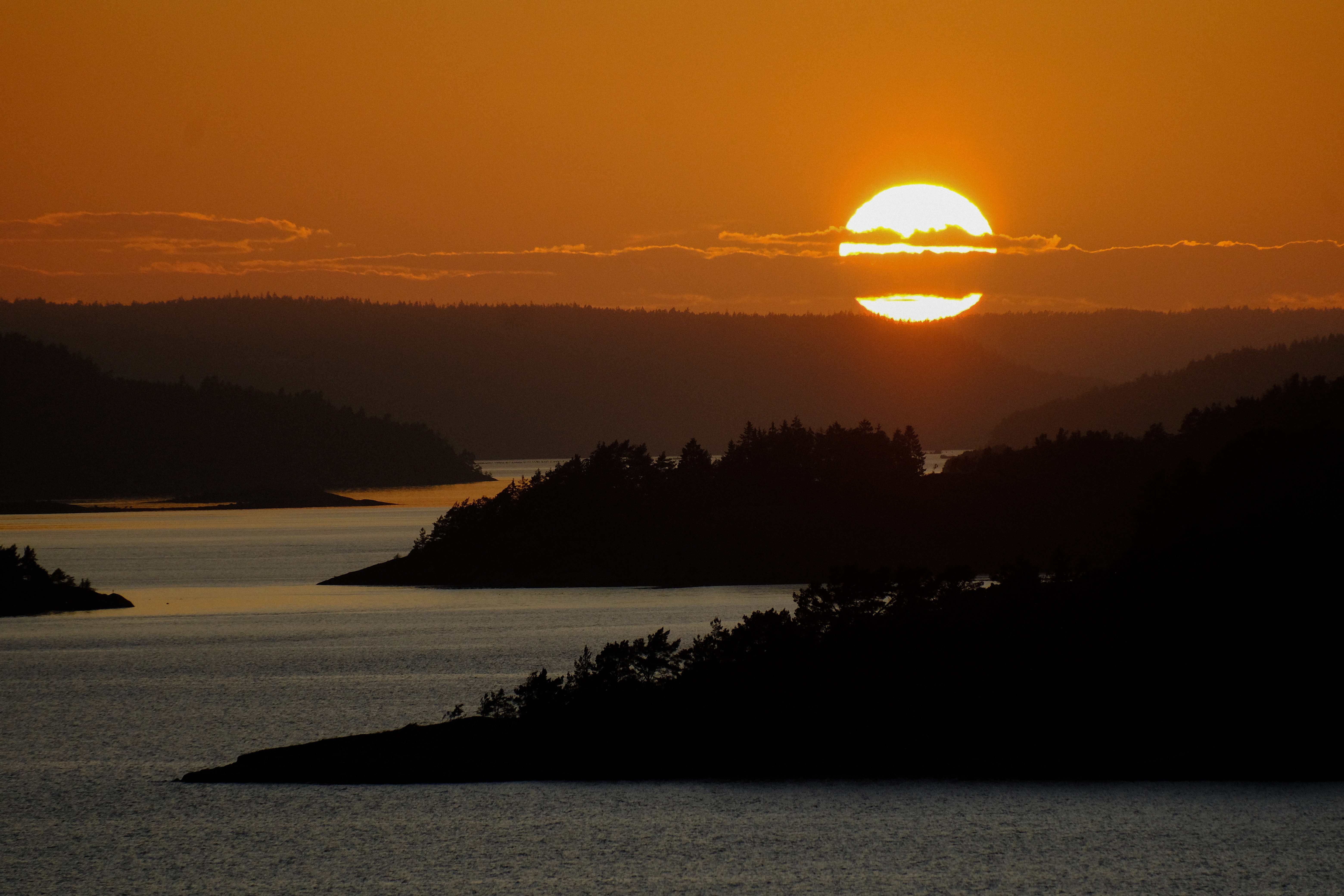 The sun setting over the Swedish coastline