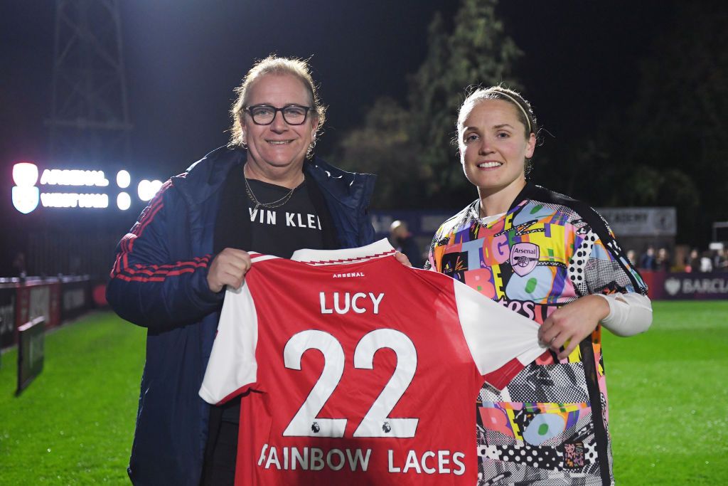 Football Referee Lucy Clark is presented with a Rainbow Laces Arsenal home shirt by Kim Little, Captain of Arsenal prior to the Barclays FA Women&#039;s Super League match between Arsenal and West Ham United at Meadow Park on October 30, 2022 in Borehamwood, England. (Photo by Alex Burstow/Arsenal FC via Getty Images)