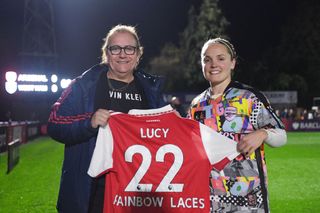 Football Referee Lucy Clark is presented with a Rainbow Laces Arsenal home shirt by Kim Little, Captain of Arsenal prior to the Barclays FA Women's Super League match between Arsenal and West Ham United at Meadow Park on October 30, 2022 in Borehamwood, England. (Photo by Alex Burstow/Arsenal FC via Getty Images)