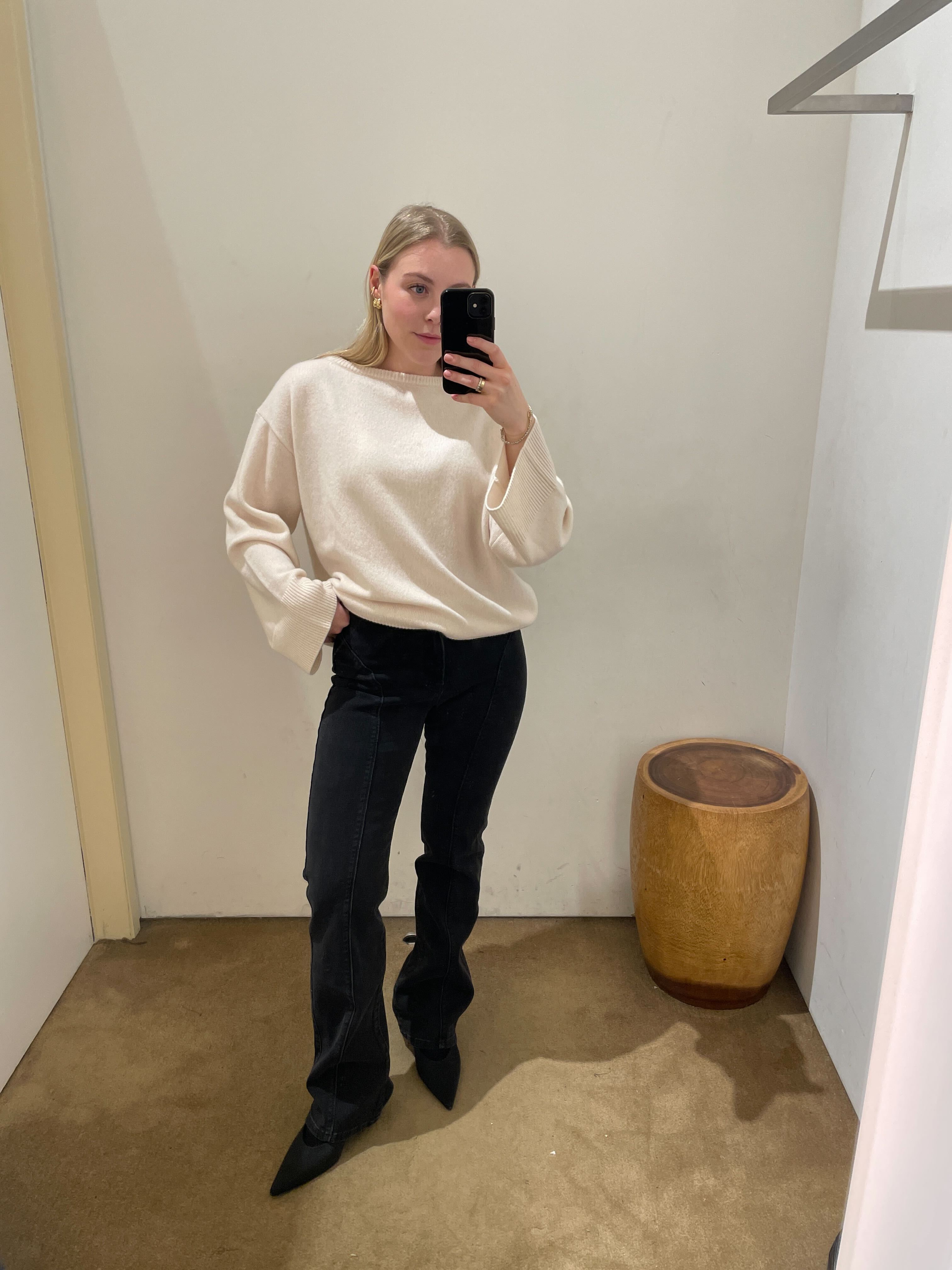 An image of Who What Wear UK shopping editor, Florrie Alexander, wearing one of the best low-rise jeans from Reformation.