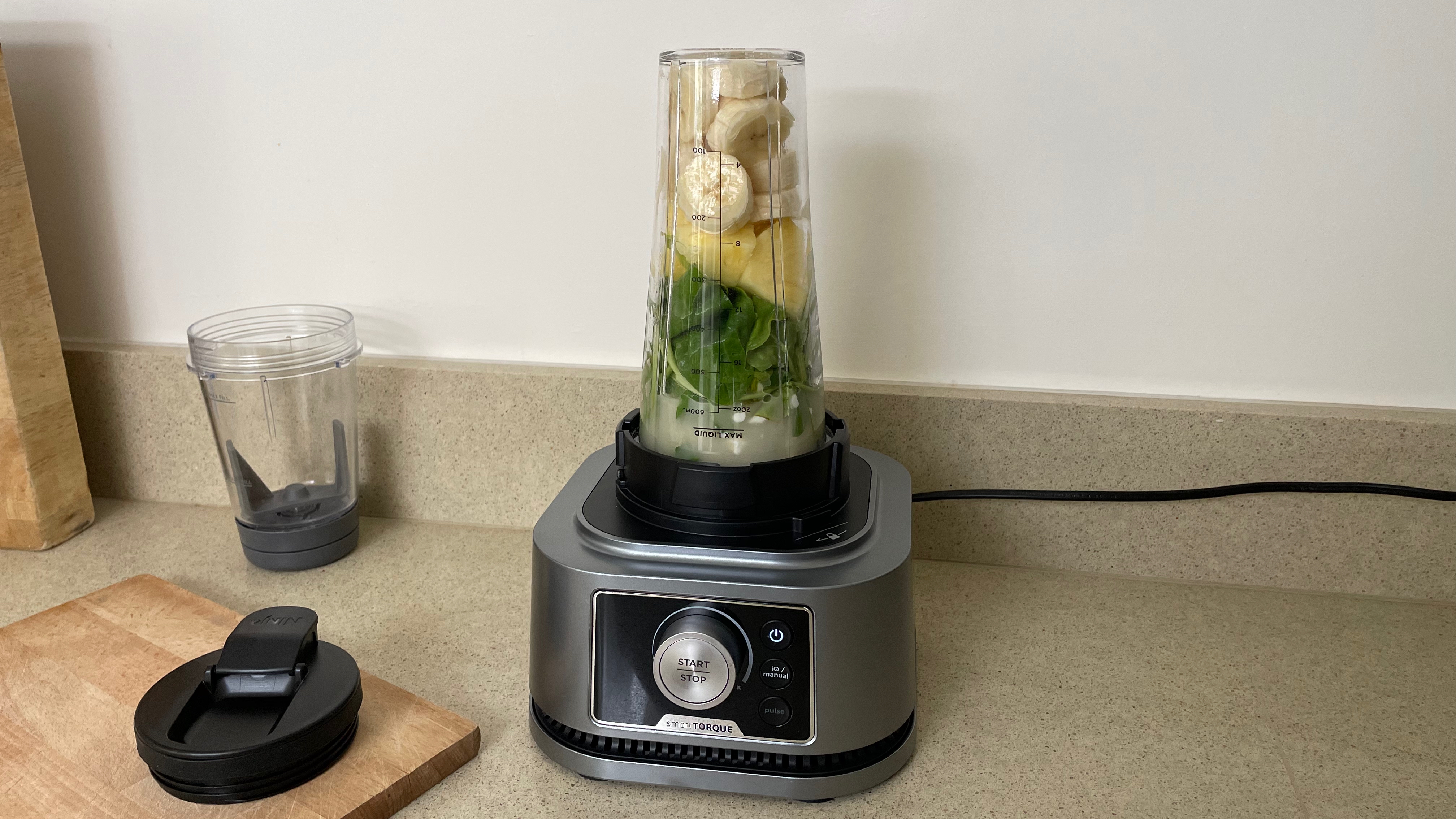 Ninja Foodi Power Blender & Processor System with banana and spinach ingredients inside