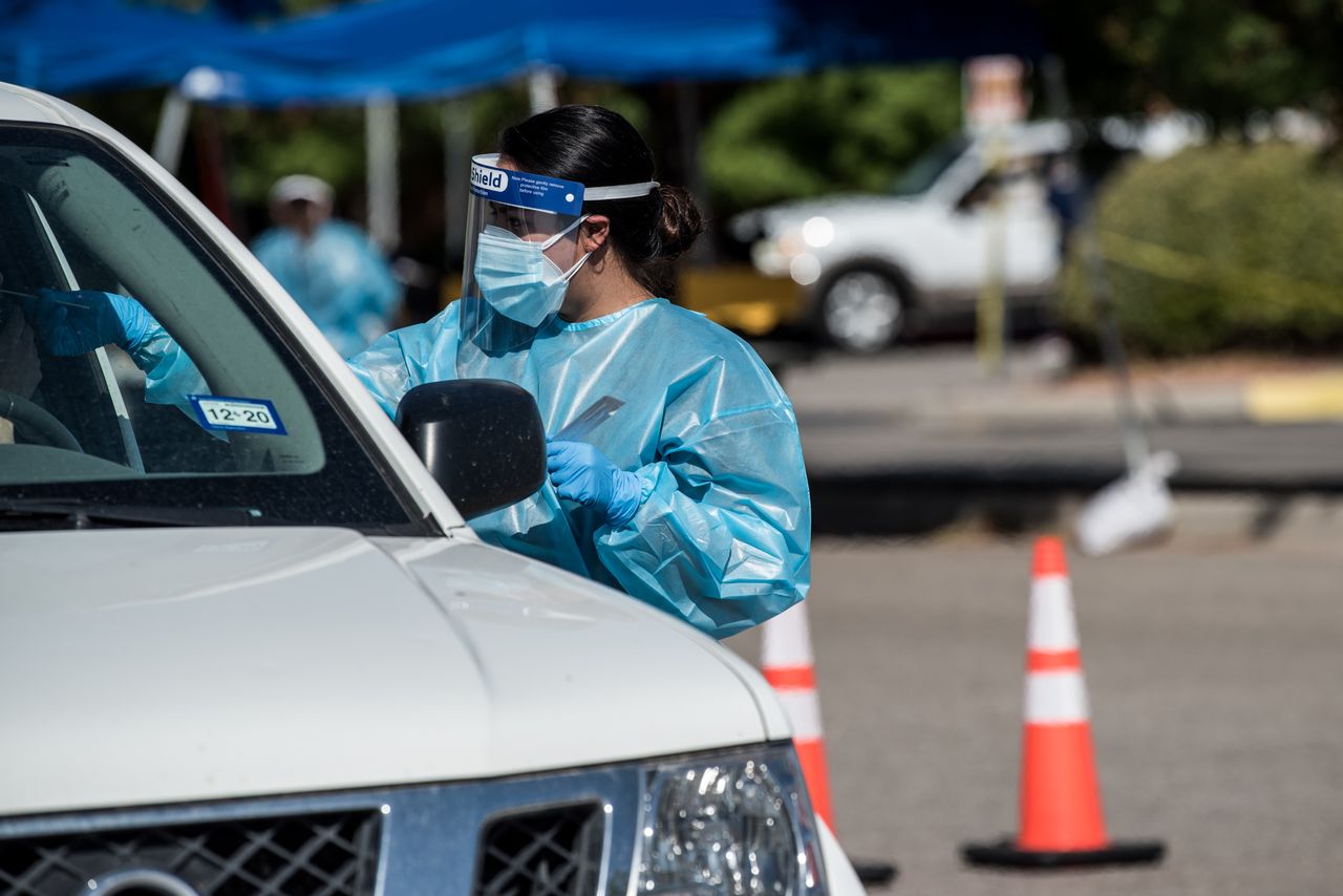 A nurse tests for COVID-19 in El Paso, Texas.