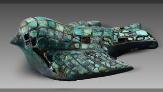 This bronze bird figurine inlaid with pieces of turquoise is among the roughly 3000 year-old artifacts unearthed from the elite tombs at the Zhaigou site.