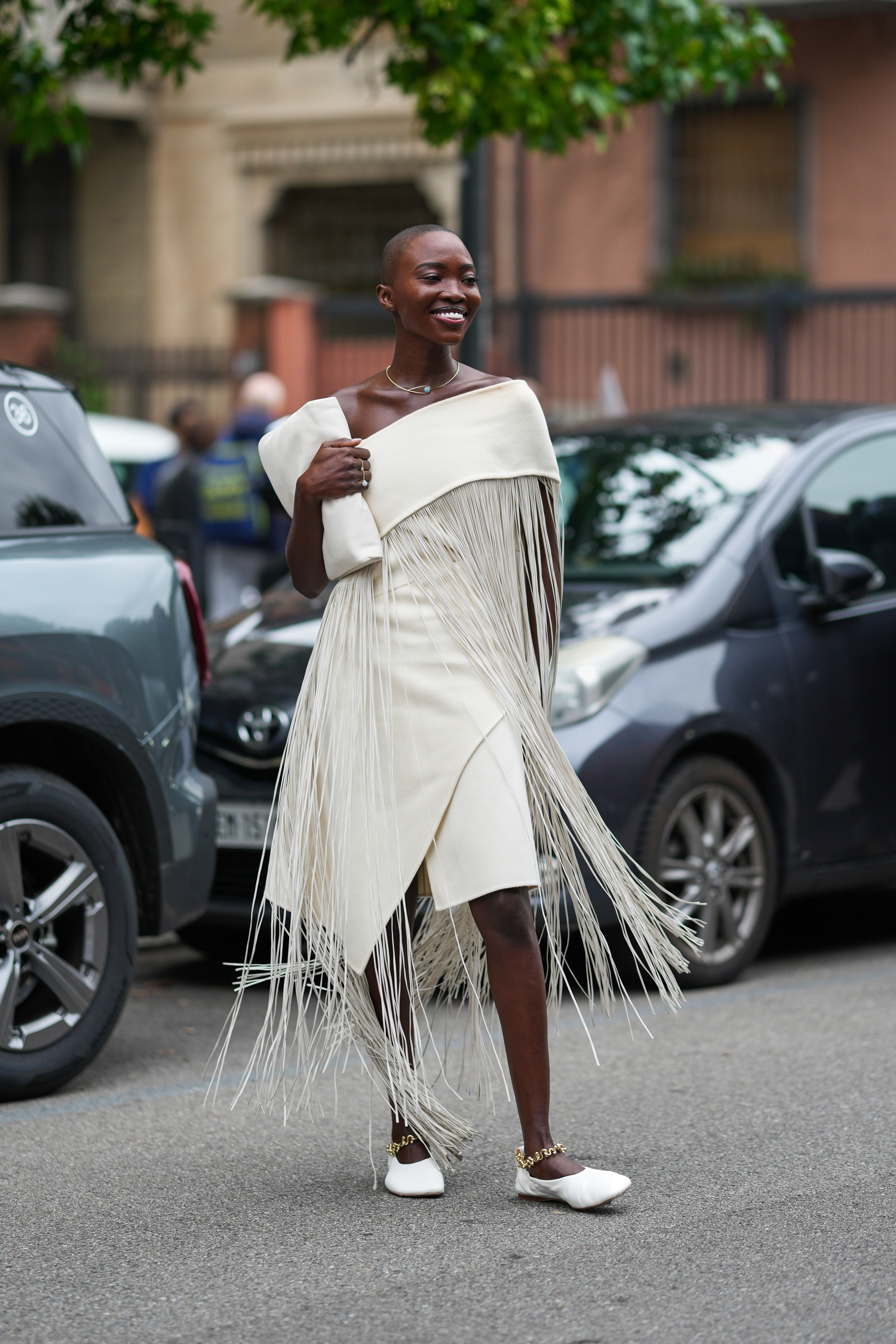 A guest at Milan Fashion Week Spring 2026 wearing the high-vamp flats trend