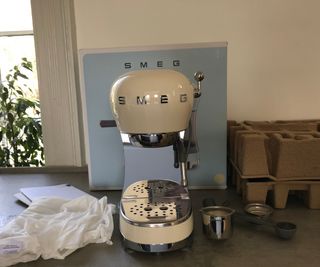 Smeg ECF02 espresso machine on the countertop, unboxed