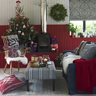 Country living room with Christmas tree and wool throws