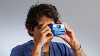 The Polaroid Go Gen 2 being held in hand by Tom's Guide staff writer Nikita Achanta