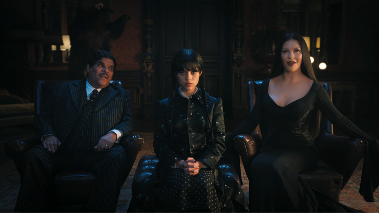 Wednesday and her parents sit in the principal&#039;s office after arriving at Nevermore Academy in Wednesday Season 1.