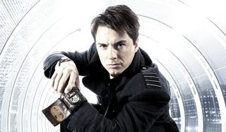 Torchwood Captain Jack Harkness poses with his time vortex manipulator