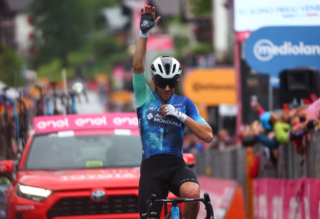 Team Decathlon AG2R's Italian rider Andrea Vendrame celebrates as he crosses the finish line to win the 19th stage of the 107th Giro d'Italia cycling race, 157km between Mortegliano and Sappada on May 24, 2024. (Photo by Luca Bettini / AFP)