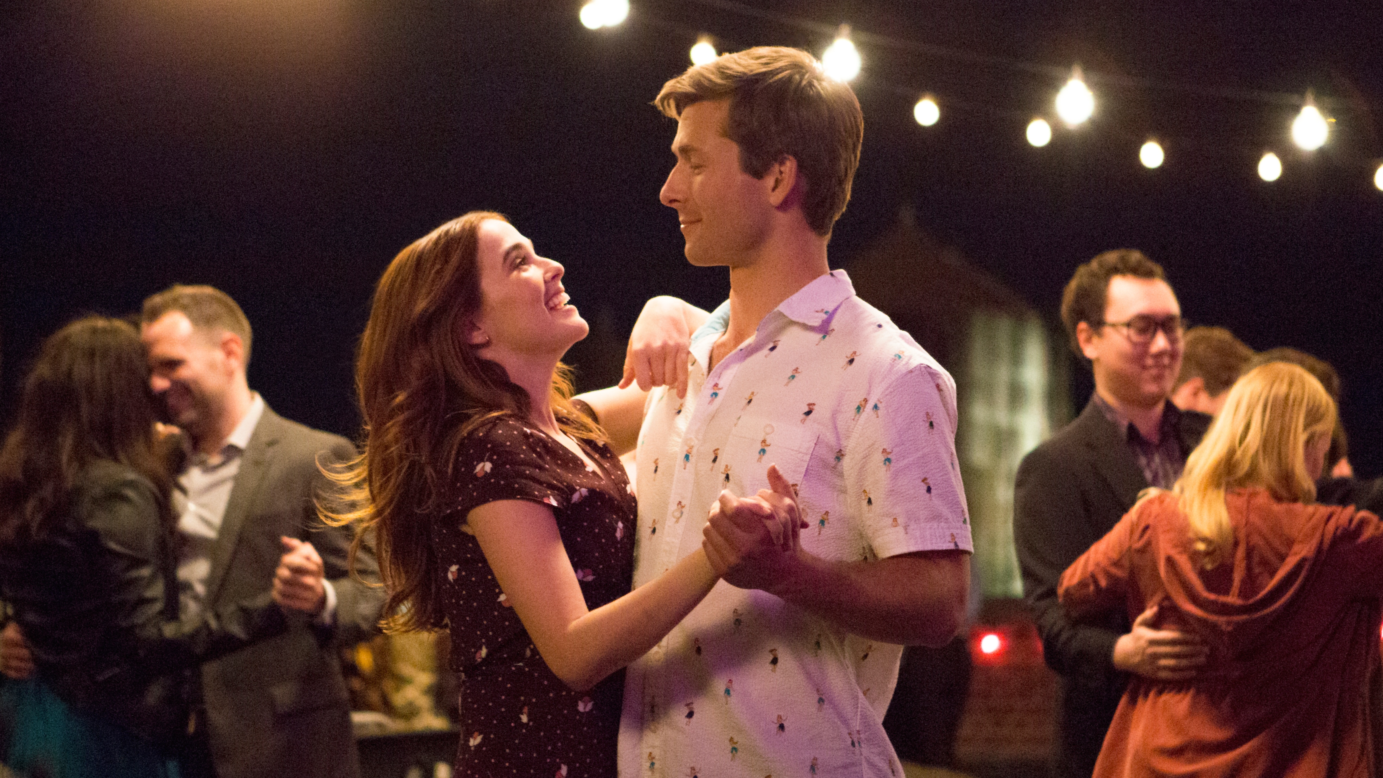 L-R: Harper (Zoey Deutch) and Charlie (Glen Powell) dancing together at a party in a scene from Netflix's &amp;quot;Set It Up&amp;quot;