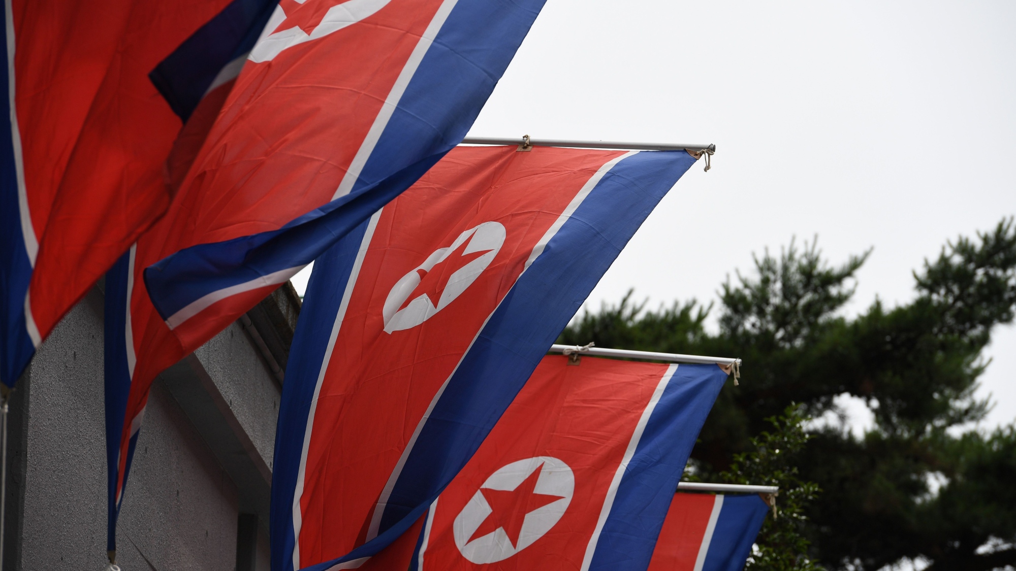 North Korean national flags are displayed outside the hall of Chongryon, the General Association of Korean Residents in Japan, during its two-day-long general assembly meeting in Tokyo on May 26, 2018