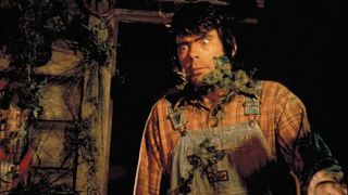 Stephen King emerging from a crypt covered in moss in 'Creepshow'