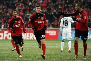 LEVERKUSEN, GERMANY - DECEMBER 19: Toni Kroos of Leverkusen celebrates scoring the first goal with team mates Arturo Vidal and Eren Derdiyok during the Bundesliga match between Bayer Leverkusen and Borussia Moenchengladbach at BayArena on December 19, 2009 in Leverkusen, Germany. (Photo by Lars Baron/Bongarts/Getty Images)