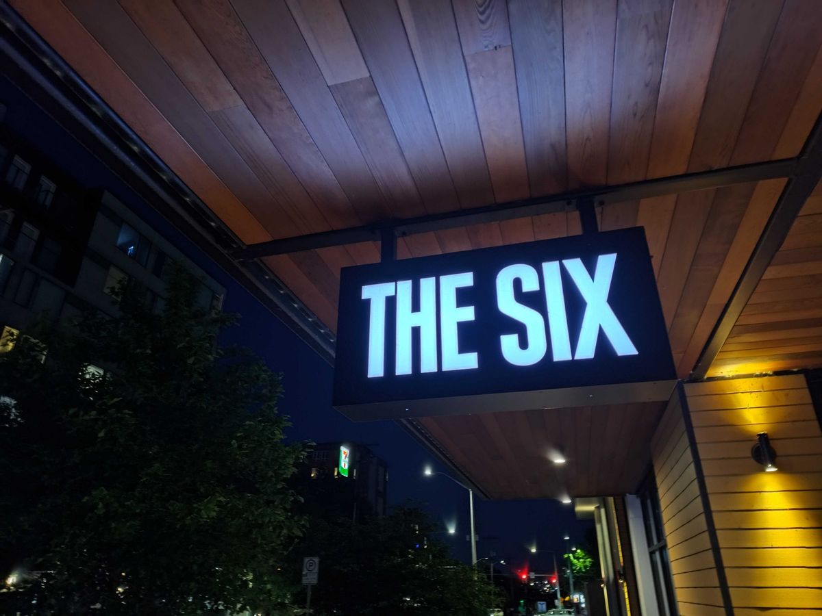 A lit sign at night