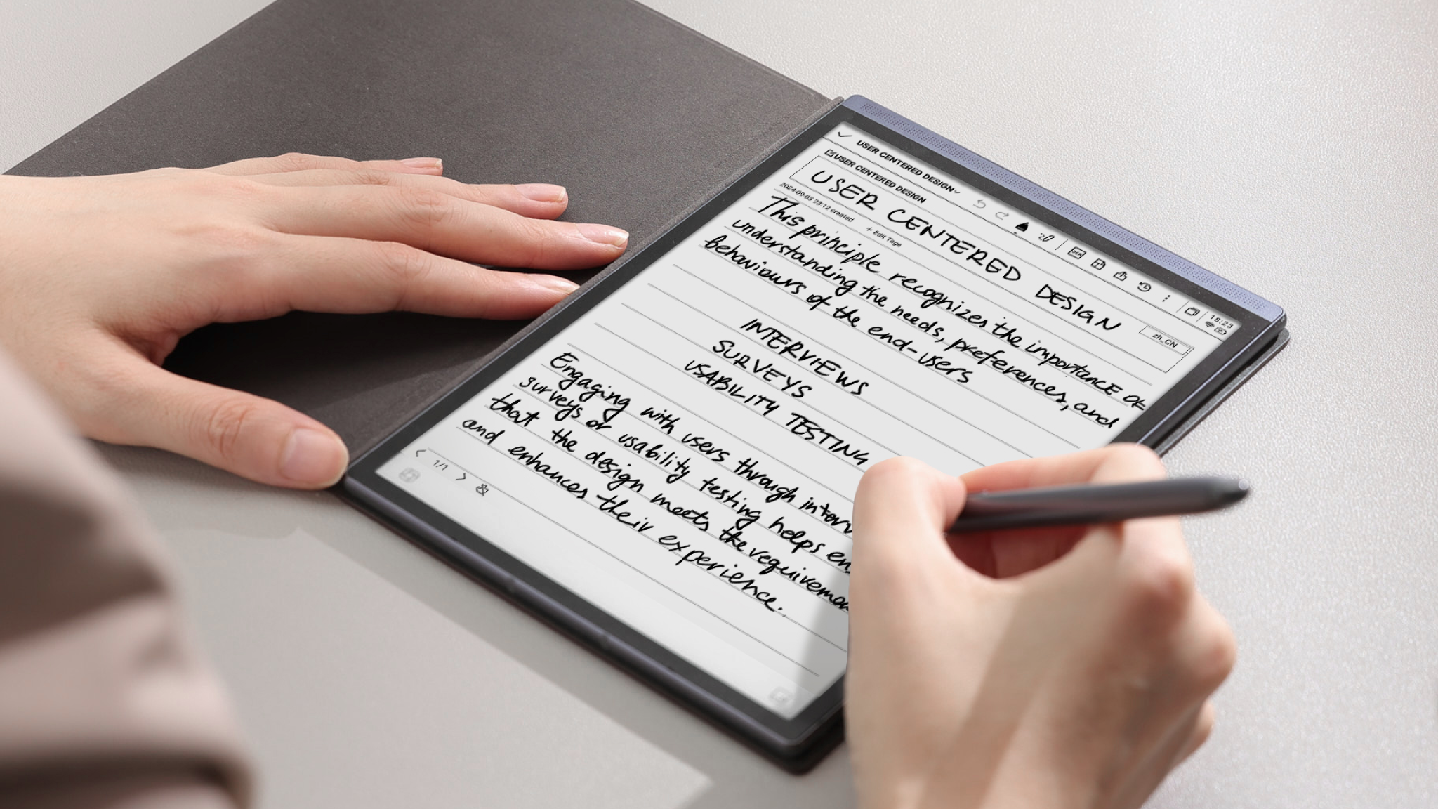 AINOTE Air 2 in close-up with someone writing using a stylus