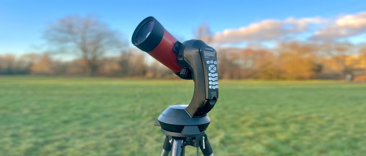 The celestron nexstar 4se set up outside in a field