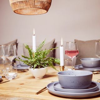 dining area with candle and bowl