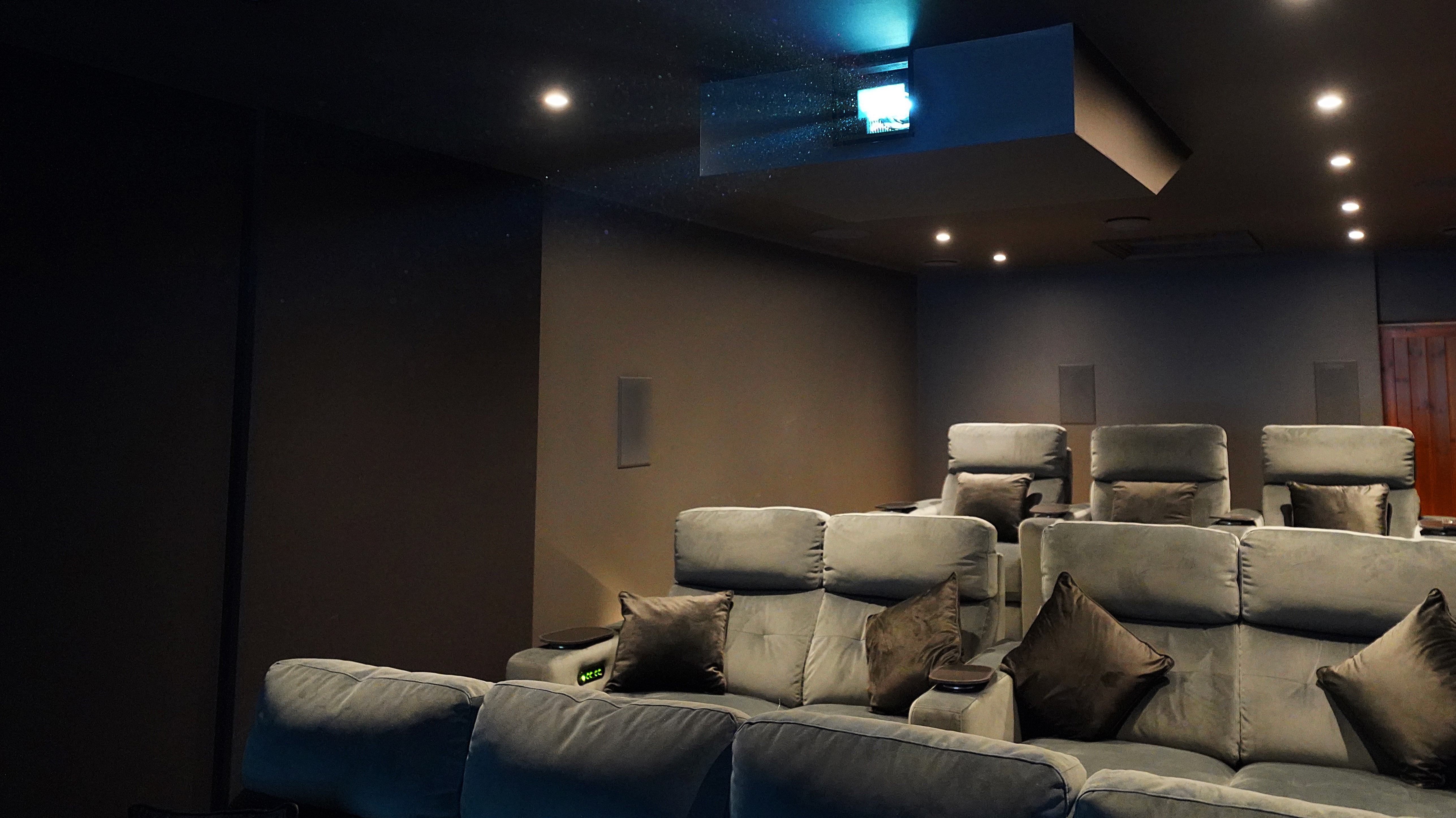 Home theater space showing comfortable seating and projector