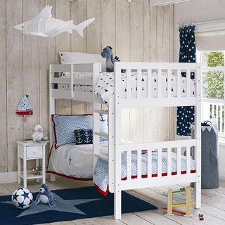 kids bedroom with wooden panel wall and white bunk beds
